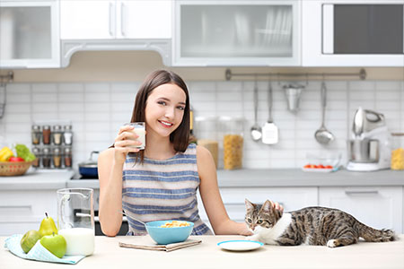 woman after having her refrigerator repaired